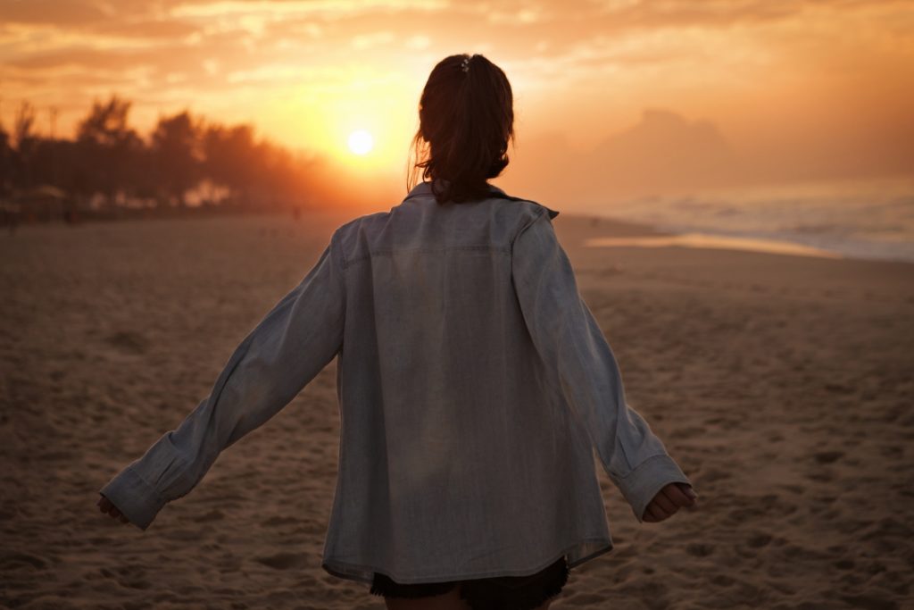 young woman looking at sunset on beach 2022 01 31 20 36 54 utc Social Anxiety