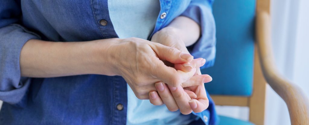 woman holding hands anxiously due to social anxiety